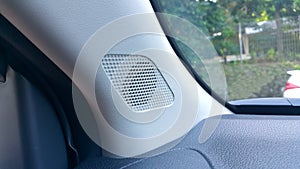 Close-up of a tweeter speaker in a car