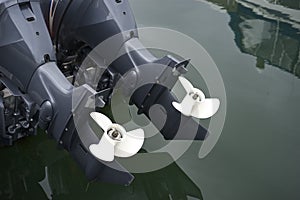 Close Up Of Twin Outboard Motors Propellers.