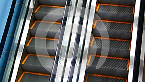 Close-up of two beautiful escalator tracks moving reversible