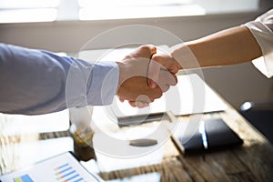 Close-up Of Two Business Partners Shaking Hands