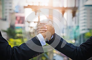 Close up of two businessman press hands each other arm wrestling
