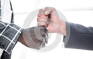 Close up.two businessmen give each other a fist