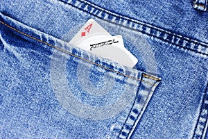 Close up two cards aces in jeans pants pocket. Concept of luck, poker games