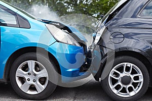 Close Up Of Two Cars Damaged In Road Traffic Accident