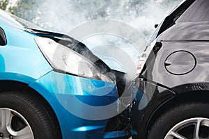 Close Up Of Two Cars Damaged In Road Traffic Accident