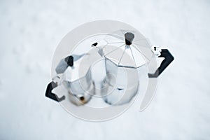 Close-up of two coffee moka over white background