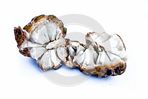 Close up of two cut custard apple or sitaphal or sugar apple isolated on white.