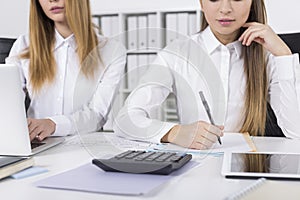 Close up of two girls working in an office