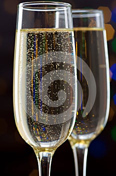 Close-up of two glasses with bubbly champagne