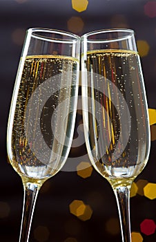 Close-up of two glasses with bubbly champagne