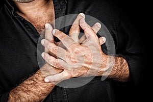 Close up of two hands grabbing a chest