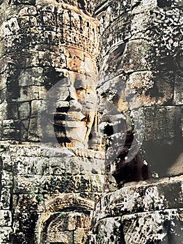 Close up of two Khmer Bayon faces, Angkor Wat, Siem Reap, Cambodia