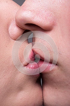 Close-up two lips kissing sensual intimate