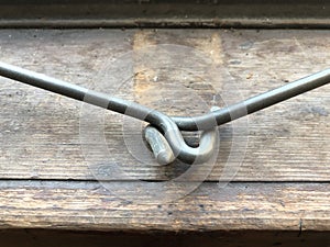 Close up of two metal hooks