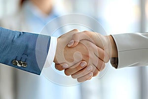 A close up of two people shaking hands