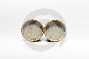 Close-up of two round cardboards isolated on white background. photo