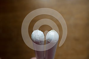 Closeup of two tampons with cardboard applicators photo