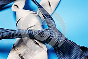 Close up two ties on blue background