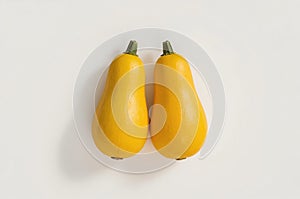 Two Yellow Zucchini on White Background