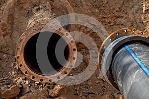 Two water pipes are installed for connection through the flanges of the water supply system