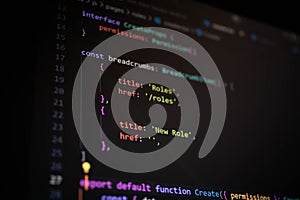 Close-up of TypeScript code displaying breadcrumb items structure with page titles and routes, representing frontend development,
