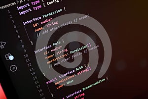 Close-up of TypeScript interface definitions for permission and role-based access control in web application development,