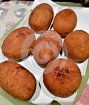 Close-up of typical Sicilian food product called `arancina` or `arancino` homemade photo
