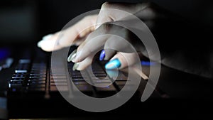 Close-up of typing female hands on keyboard