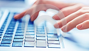 Close-up of typing female hands on keyboard