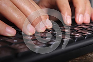 Close-up of typing male hands