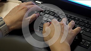 Close-up of typing male hands. close up blurred view of male hand touching computer keyboard. Close-up of male hands