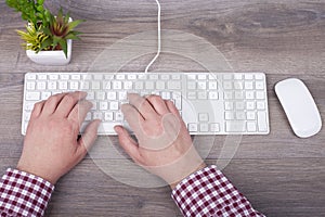 Close-up of typing male hands on keyboard