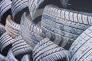 Close up tyres stacked outside for recycling