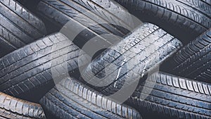 Close up tyres stacked recycling 16x9