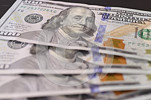 Close up of U.S. 100 dollar bills.