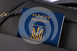 Close up of Ukraine Passport in Black Suitcase Pocket