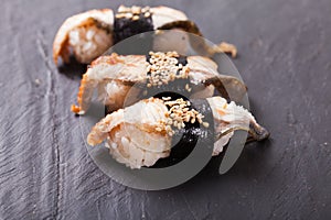 Unagi nigiri sushi set on the black slate photo