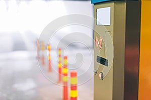 Close-up, underground parking with a barrier. Against the background of the exit