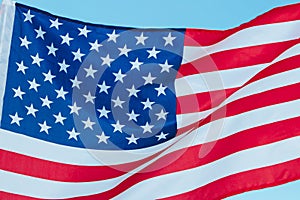 Close up of United States of America Flag. The star-spangled flag on the sky background