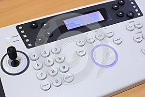 Close-up of the universal remote control with photo