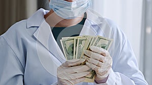 Close-up unrecognizable doctor nurse medical worker surgeon practitioner in white coat protective face mask and latex