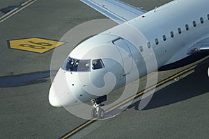 CLOSE UP: Unrecognizable pilots sitting in the cockpit steer the airplane.