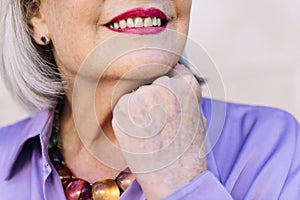 close up of an unrecognizable smiling senior woman