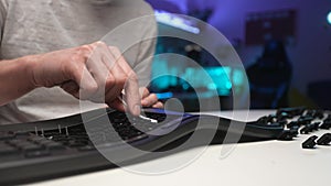 Close-up unrecognizable technician male hands cleaning dirty disassembled keyboard using cotton bud wipes on background