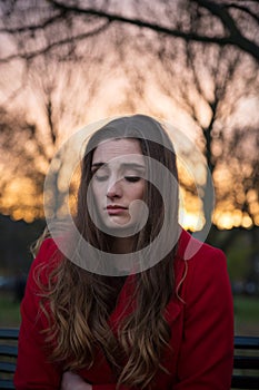 Close up of an upset young woman alone in her thoughts