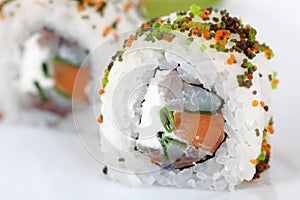 Close up of Uramaki with sardine and carrots. Traditional japanese sushi rolls