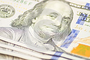 Close up of US 100 dollar bills finance concept. Dollars closeup. Benjamin Franklin's portrait on one hundred dollar