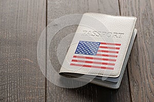 Close up on a USA passport on wooden background