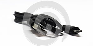 Close-up USB cable isolated on a white background. Black color micro usb cable