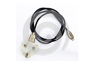 Close-up USB cable isolated on a white background. Black color mobile charging cable